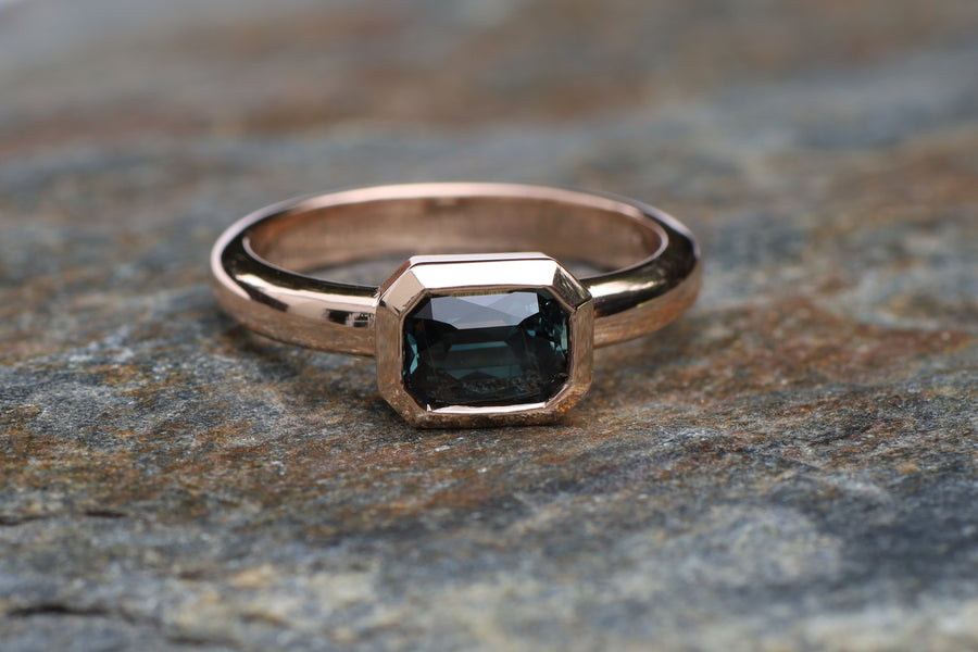 1.68ct Emerald cut colour change sapphire on 9ct rose gold.