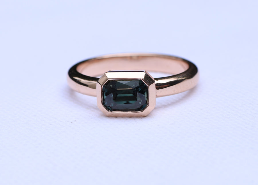 1.68ct Emerald cut colour change sapphire on 9ct rose gold.