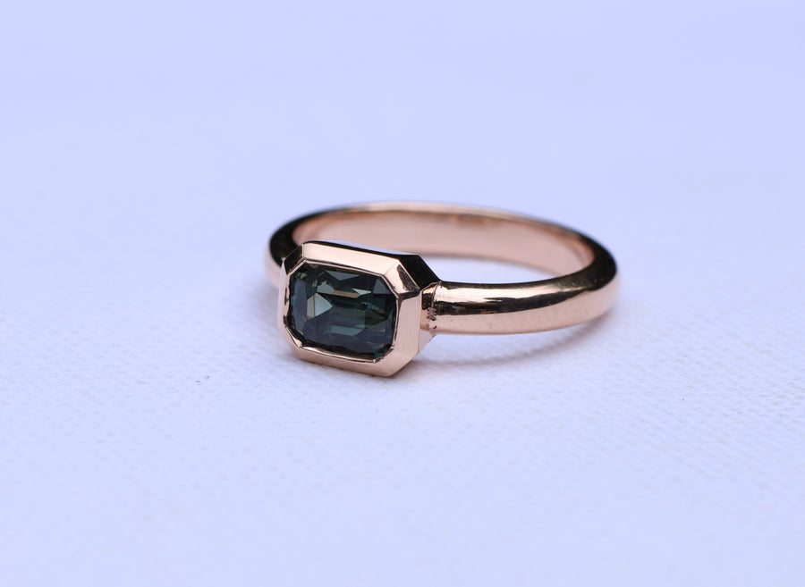 1.68ct Emerald cut colour change sapphire on 9ct rose gold.