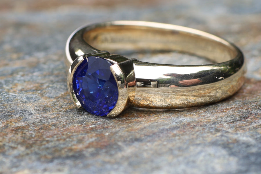 1.62ct Royal Blue Sapphire in Partial Bezel in 9ct yellow gold