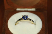 1.09ct Claw Set Blue Sapphire with 0.30ct Black Diamonds in 9ct Yellow Gold Ring