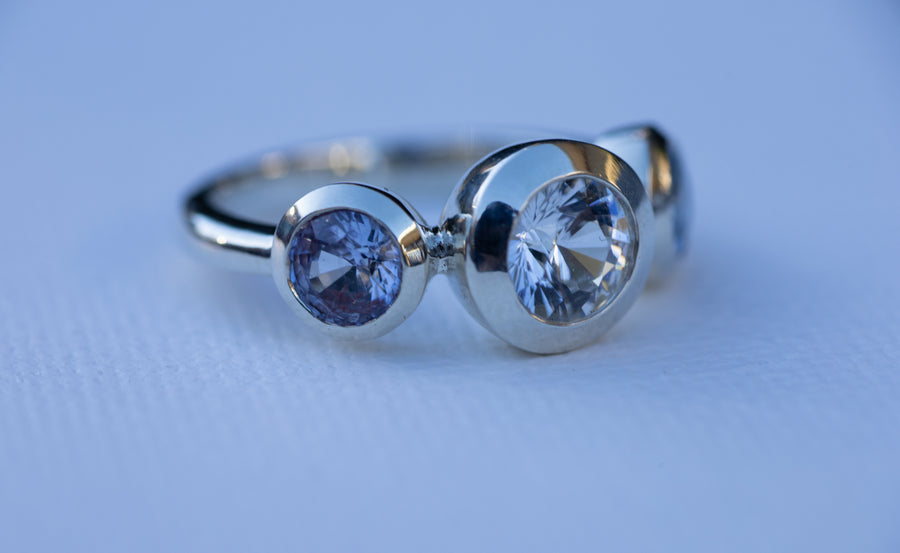 1ct White Sapphire with 2 Blue Sapphires in 9ct White Gold